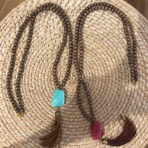Beaded necklace with tassel bundle